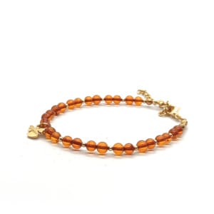 Bransoletka z aniołkiem, Bursztyn koniakowy, stal chirurgiczna pozłacana 16-20cm KAM1273