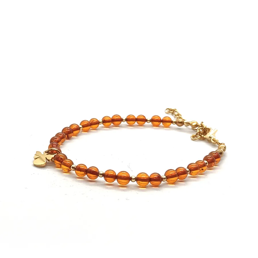 Bransoletka z aniołkiem, Bursztyn koniakowy, stal chirurgiczna pozłacana 16-20cm KAM1273